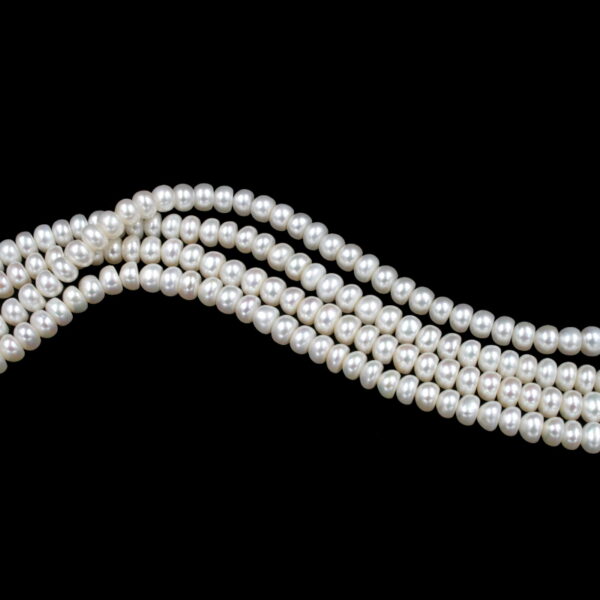 Fresh Water Pearls strands "bottone" shape size 6-6½mm