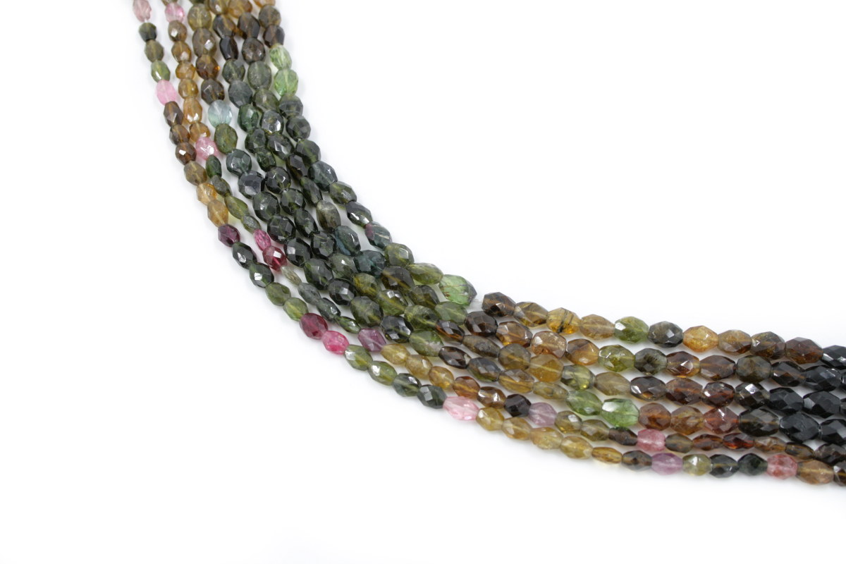 Tourmaline strands faceted lentil shape
