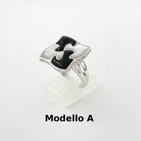 Anello puzzle in Argento 925‰ con zirconi elementi in pietra dura e madreperla
