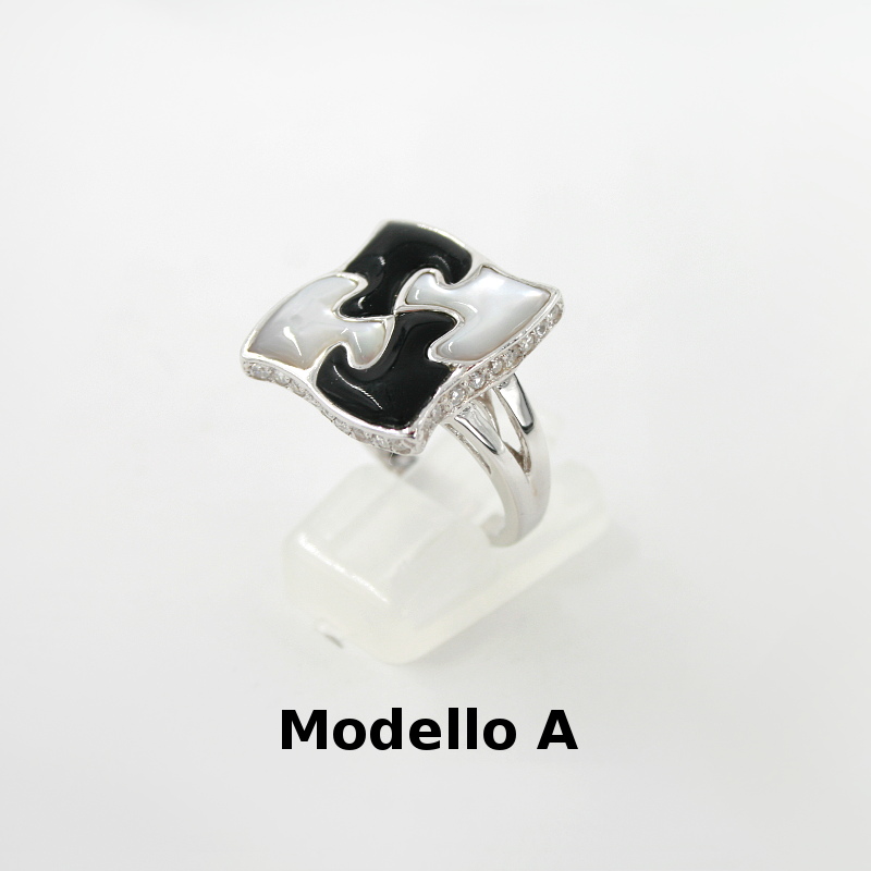 Anello puzzle in Argento 925‰ con zirconi elementi in pietra dura e madreperla