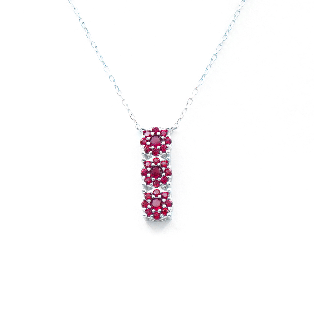 Sterling Silver necklace with trilogy pendant with red zircons – Rhodium Color