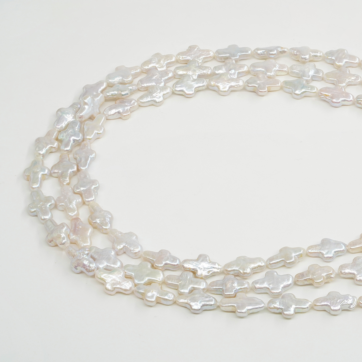 Fresh Water Pearls strands cross shape