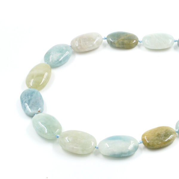 Aquamarine strands flat oval shape size ~14x23mm+/-