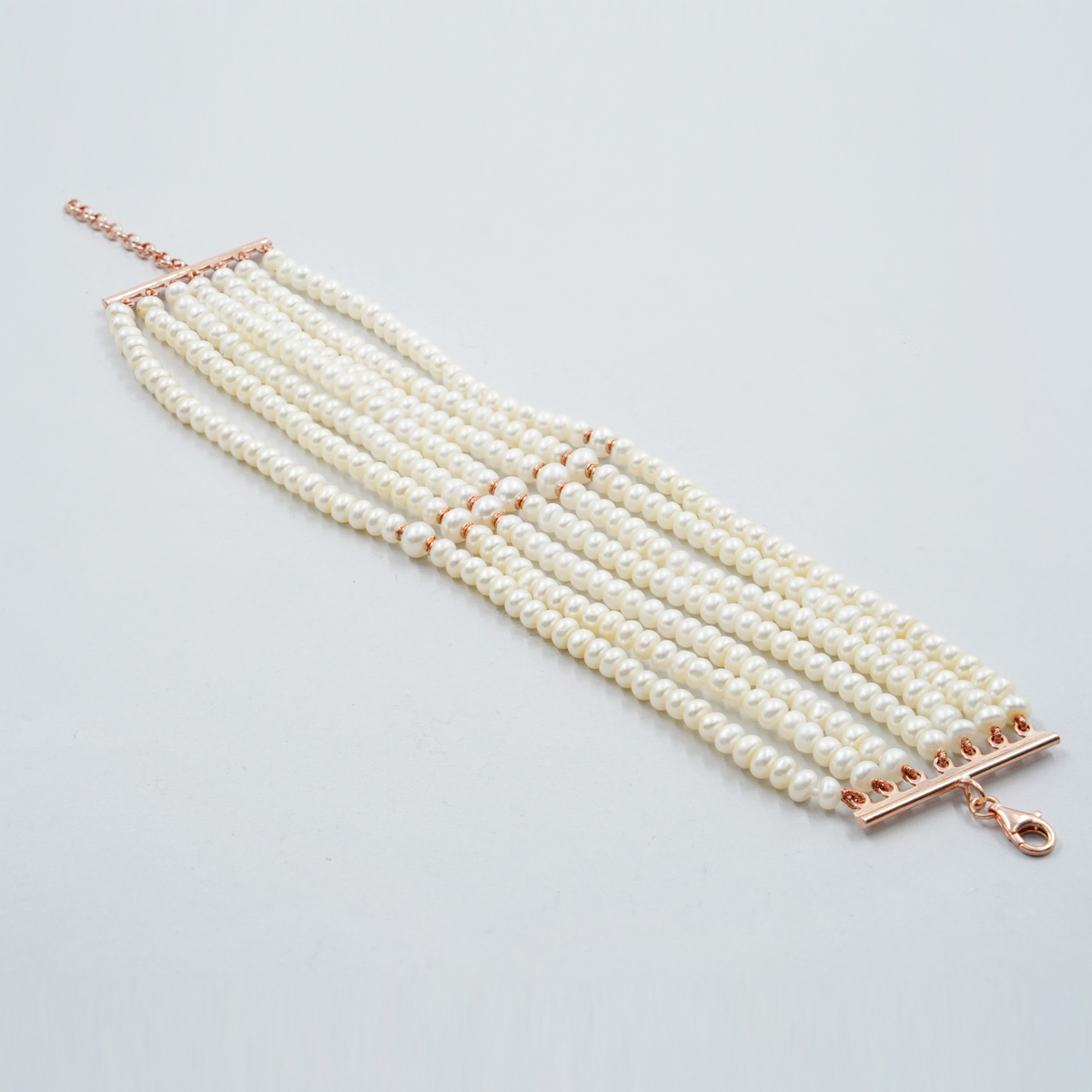 Bracciale Multifilo con perle forma bottone, chiusura in argento – Rosè