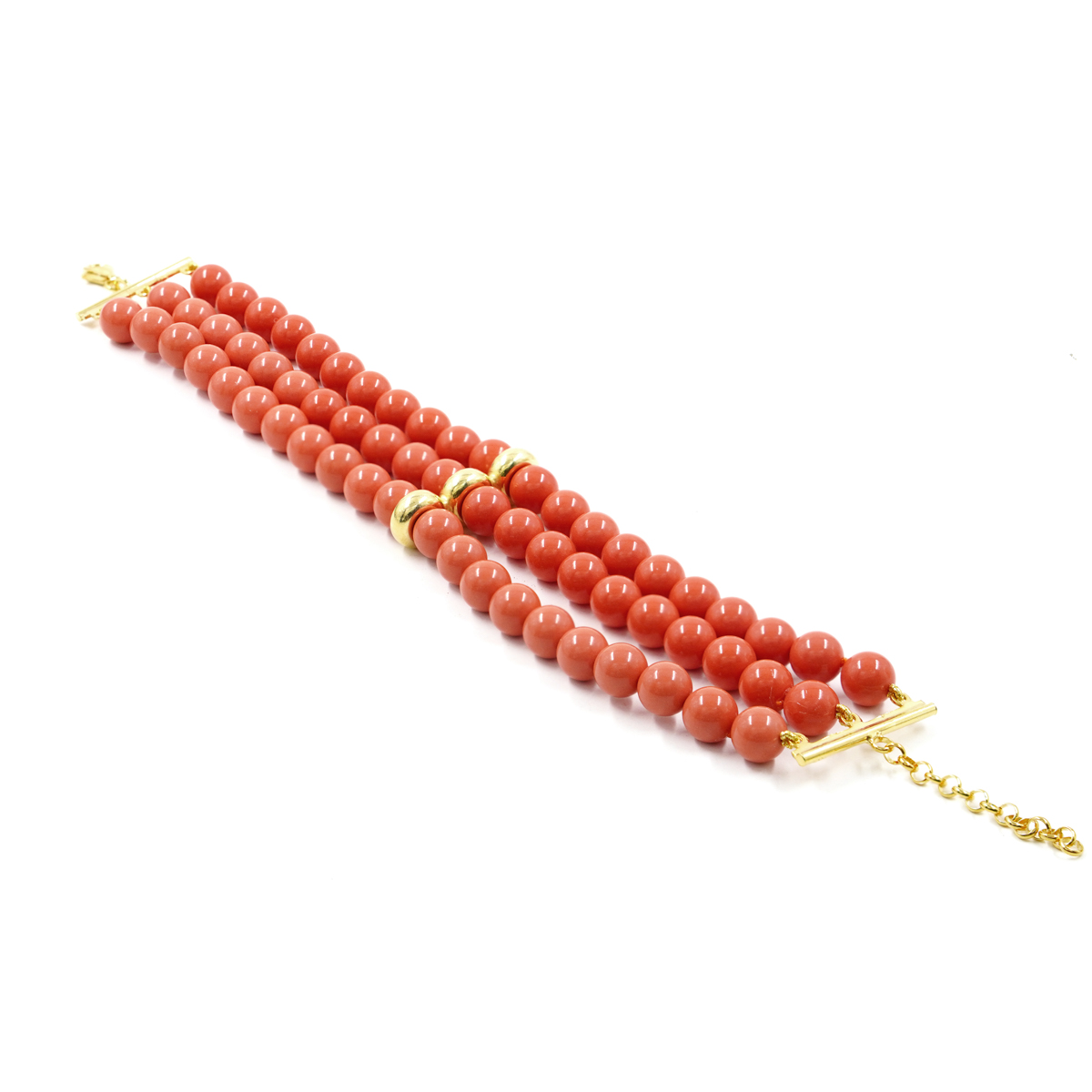 Multistrand bracelet with orange recon coral, golden color silver clasp and element