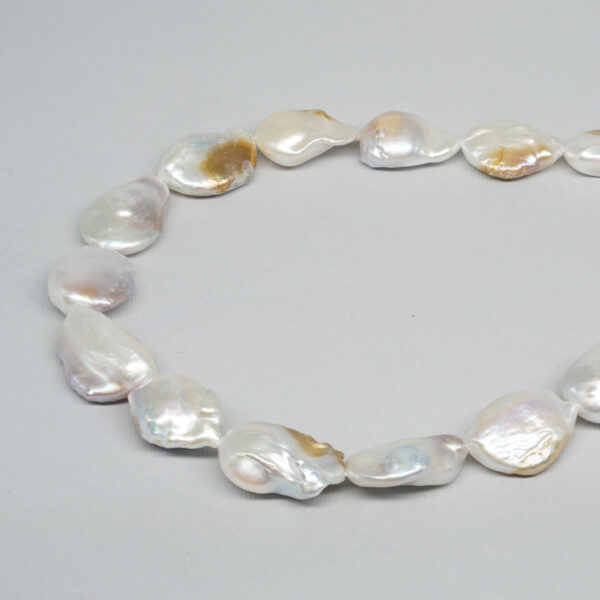 Fresh Water Pearls strands flat nucleated free form shape size 15-18mm