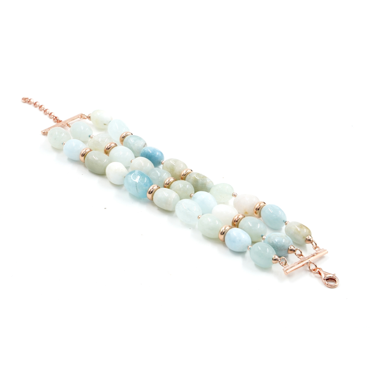 Multistrand bracelet with aquamarine, rose color silver clasp