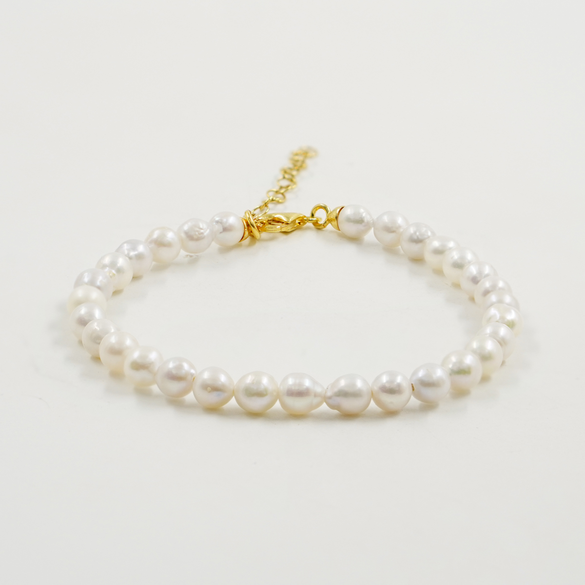 Bracciale perle, chiusura argento dorato